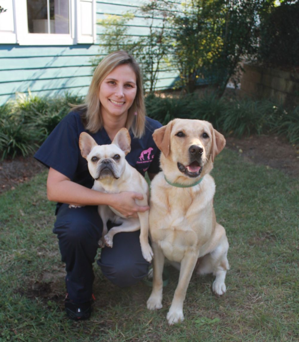 Dr. Barnett with two dogs outside